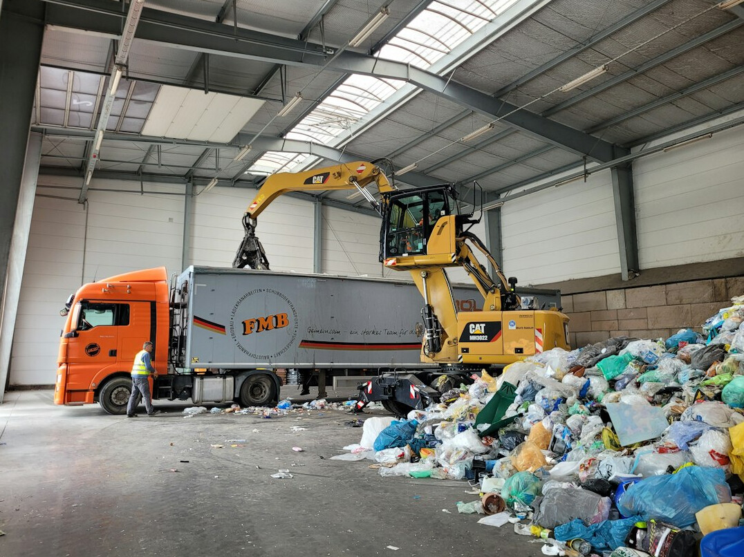 Waste sorting and recycling facility conveyor belt